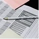 Documents and planning materials on a desk, representing customized solutions tailored to client needs.